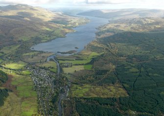 General oblique aerial view centred on the village with Loch Tay adjacent, taken from the SW.