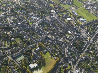 Oblique aerial view centred on the High Street, taken from the NW.