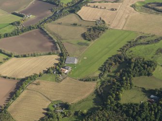 Oblique aerial view centred on the grass airfield, taken from the WSW.
