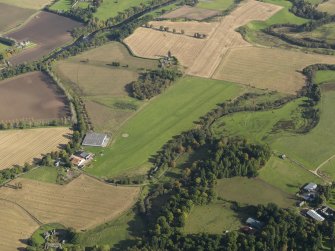 Oblique aerial view centred on the grass airfield, taken from the SW.