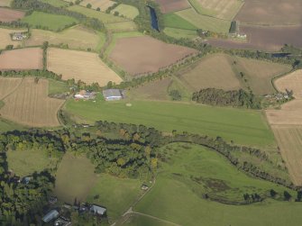 Oblique aerial view centred on the grass airfield, taken from the S.
