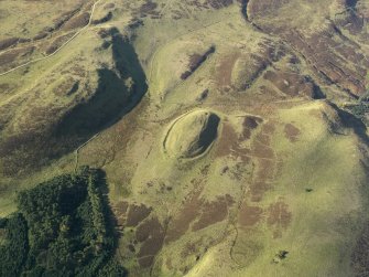 Oblique aerial view centred on the remains of the fort, taken from the ENE.