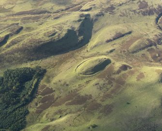 Oblique aerial view centred on the remains of the fort, taken from the NE.