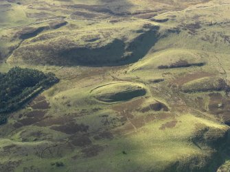 Oblique aerial view centred on the remains of the fort, taken from the NNE.