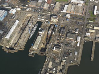 Oblique aerial view centred on the dry docks, taken from the SSE.