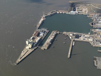 Oblique aerial view centred on the dockyard, taken from the E.