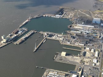 General oblique aerial view centred on the dockyard, taken from the E.