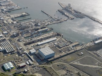 Oblique aerial view centred on the dockyard, taken from the WNW.
