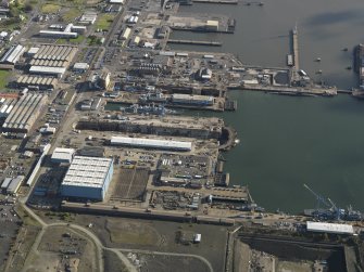 Oblique aerial view centred on the dry docks, taken from the W.