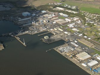 General oblique aerial view centred on the dockyard, taken from the SE.