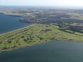 General oblique aerial view centred on the golf courses, taken from the NW.