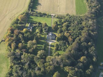 Oblique aerial view centred on the house, taken from the ESE.