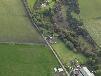 Oblique aerial view centred on the cottage, taken from the N.