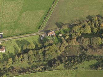 Oblique aerial view centred on the cottage, taken from the W.