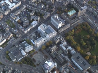 Oblique aerial view centred on the University Information Centre with the McEwan Hall adajacent, taken from the NW.