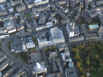 Oblique aerial view centred on the University Information Centre with the McEwan Hall adajacent, taken from the W.