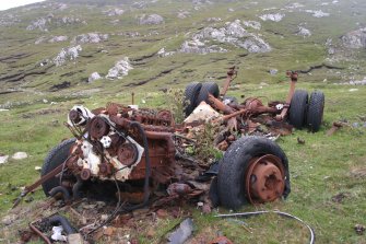 View of a destroyed vehicle which has been used as a target within the Cape Wrath Training Centre. The vehicles is one of eight situated within the fort (NC37SE 1) on Eilean nan Caorach.