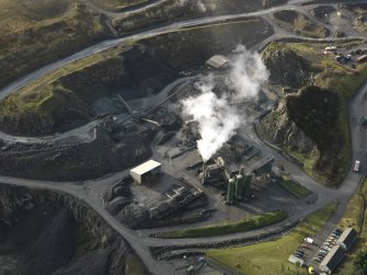 Oblique aerial view centred on the quarry, taken from the NE.