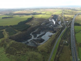 Oblique aerial view centred on the quarry, taken from the NE.