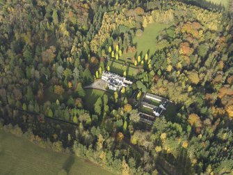 Oblique aerial view centred on the house with the garden adjacent, taken from the SSE.