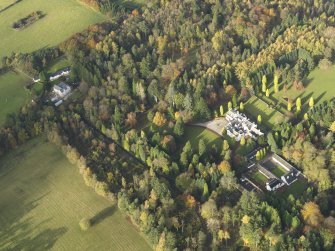 Oblique aerial view centred on the house with the garden adjacent, taken from the SE.