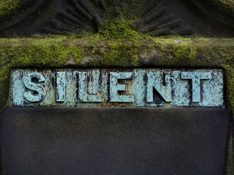 Detail of bronze plaque on monument in memory of Patrick Ritchie (died 18th December 1963).  Located in the front section of Grange Cemetery.