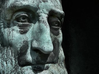 Detail of bronze relief portrait on monument in memory of John Burn MD, FRCS (died 18th November 1885).  Located in the front section of Grange Cemetery.