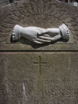 Detail of sculpture on monument in memory of Patrick Johnston located in Rosebank Cemetery.