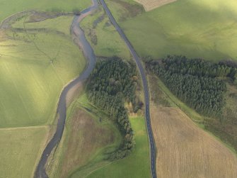 General oblique aerial view centred on the motte (in trees), taken from the SW.