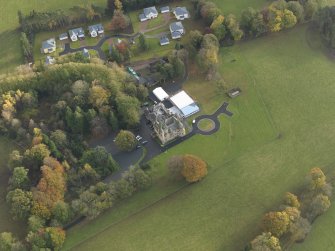 Oblique aerial view centred on the house, taken from the N.