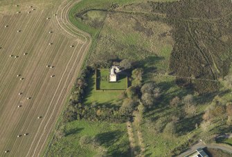 Oblique aerial view centred on the tower house, taken from the NE.