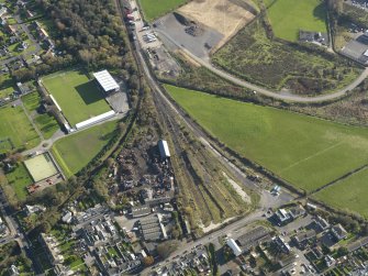 Oblique aerial view centred on the remains of the railway yards with the Town Station adjacent, taken from the WNW.