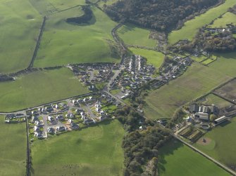 General oblique aerial view centred on the village, taken from the NNE.