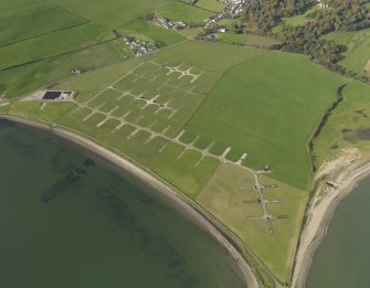 Oblique aerial view centred on the flying boat base hardstandings, taken from the E.