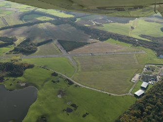 General oblique aerial view centred on the airfield, taken from the NNW.