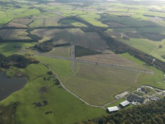 General oblique aerial view centred on the airfield, taken from the NW.