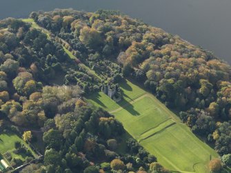 Oblique aerial view centred on the gardens and ruins of Castle Kennedy in Dumfries and Galloway, taken from the NE.