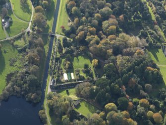 Oblique aerial view centred on the canal with the vegetable garden adjacent, taken from the NNE.