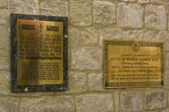 Interior. W end. Memorial plaques. Detail