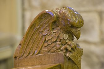 Interior. Chancel. Minister's chair and desk. Detail of Evangelist carving.