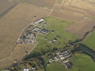 Oblique aerial view centred on the technical site with the control tower adjacent, taken from the SW.