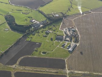 Oblique aerial view centred on the technical site with the control tower adjacent, taken from the NE.