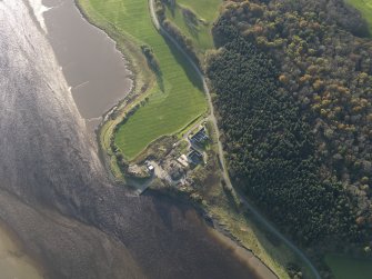 Oblique aerial view centred on the saw mill with the remains of the former Air Sea Rescue yard adjacent, taken from the NE.