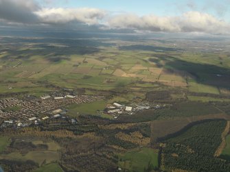 General oblique aerial view centred on the airfield, taken from the S.