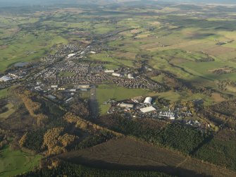 General oblique aerial view centred on the airfield, taken from the SE.