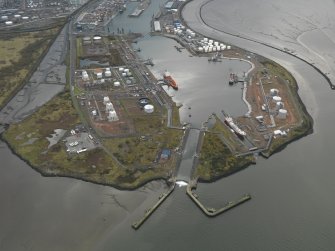 General oblique aerial view centred on the docks, taken from the NE.