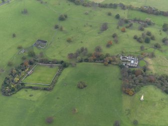 Oblique aerial view centred on the walled garden with the remains of a farmstead adjacent, taken from the ENE.