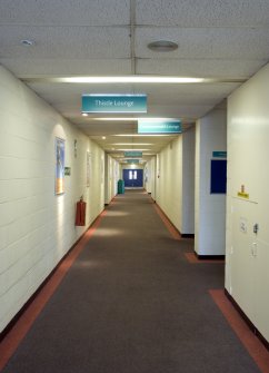 Interior. View of corridor leading to cafe and lounges.