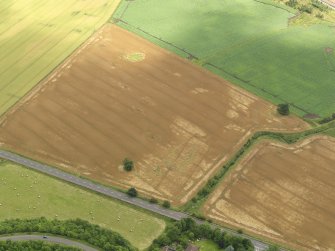 Oblique aerial view centred on the cropmarks of the drains at Huttonburn Bridge, taken from the NW.