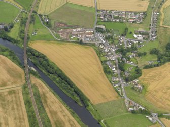 Oblique aerial view of the village of Marykirk and the adjacent cropmarks of the rig and furrow, taken from the SSW.